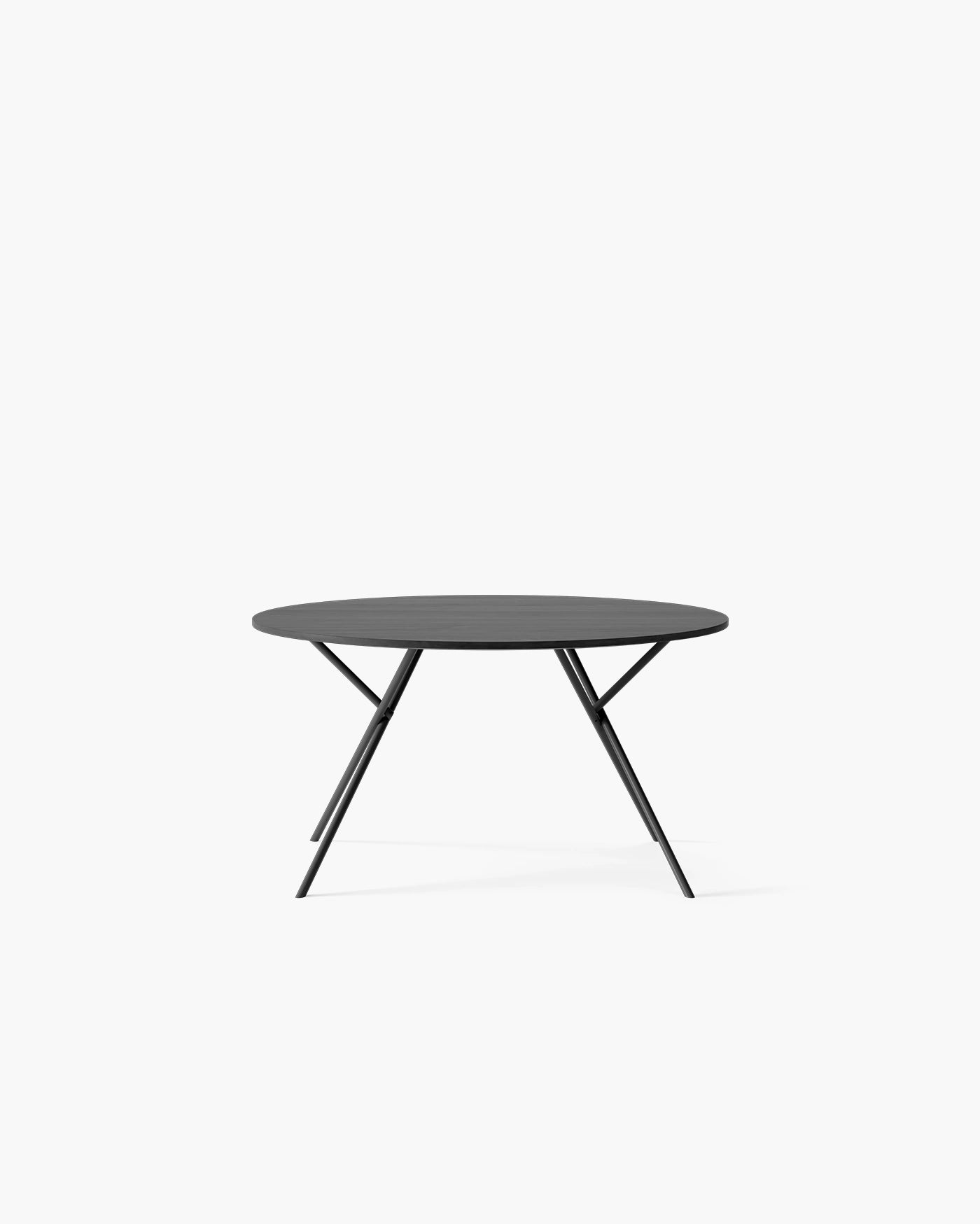 Luna Dining Table in black oak, featuring a modern round design with elegant, striking black legs.